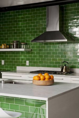 Beautiful houses and gardens - Green kitchen with subway tiles.jpg